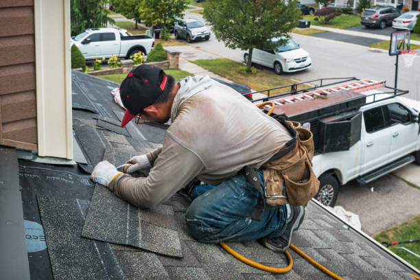 Professional Roofing technician working in Ardsley, NY